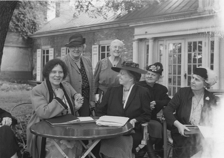 caption: Alice Paul (left) with NWP members, 1950. 