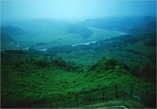 A view of a foggy mountainous valley scene