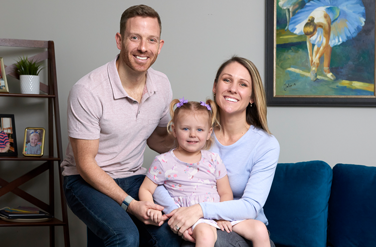 caption: Benjamin Prosser, director of the new Center for Epilepsy and Neurodevelopmental Disorders, with his daughter, Lucy, and wife, Erin.