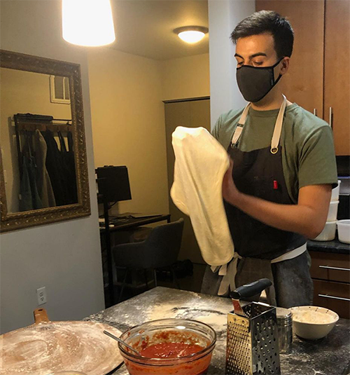 caption: Wharton MBA student Ben Berman learned to make pizza from scratch as a quarantine hobby and as a respite from eating fast food while traveling. 