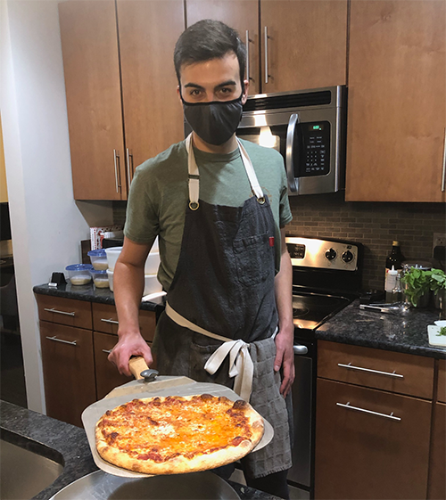 Ben Berman pulls another Good Pizza out of the oven. 