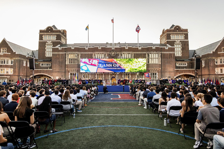 caption: Members of the Class of 2029 on Franklin Field during Convocation.