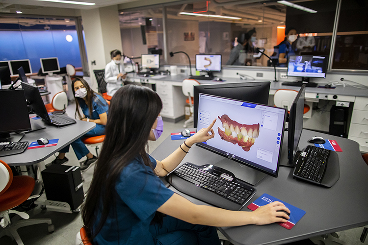 caption: Students can practice and design interventions on the screen, saving time and resources. Research will inform advances in digital dental technology. Photo by Eric Sucar