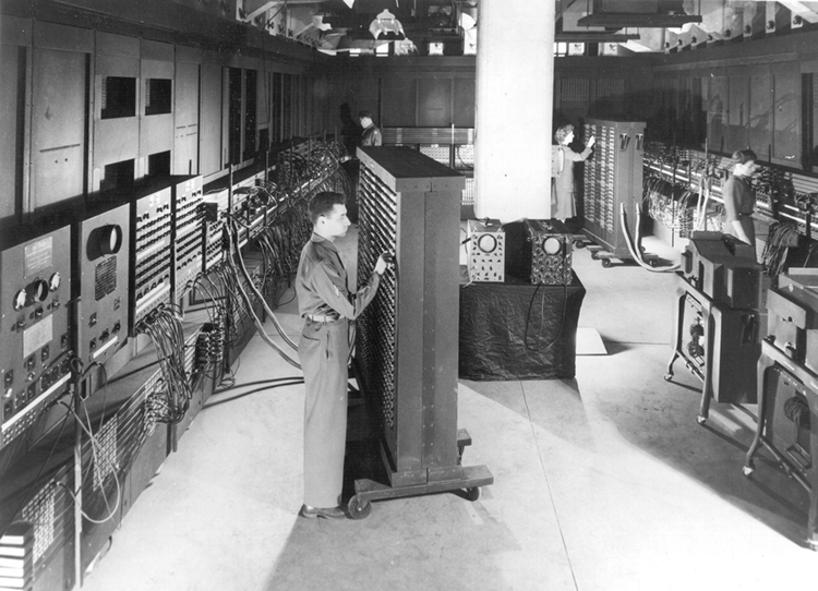 caption: An ENIAC programmer in 1946.