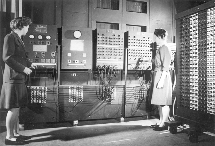 caption:  Jean Bartik (left) and Frances Spence operating ENIAC’s main control panel.