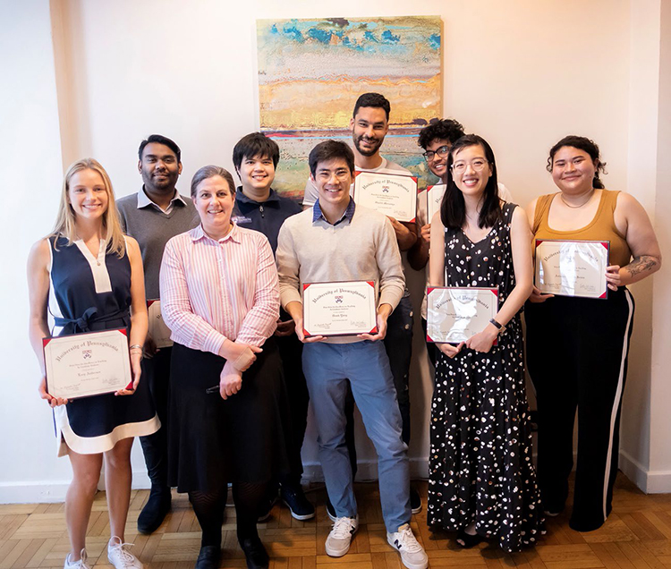 caption: Front (left to right): Lucy Andersen, Vice Provost Karen Detlefsen, Derek Yang, Ann Ho, Arianna James. Back (left to right): Ritesh Isuri, Adiwid (Boom) Devahastin Na Ayudhya, Oualid Merzouga, Puneeth Guruprasad