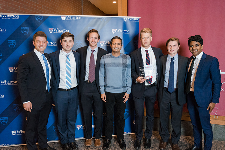 caption: Left to right: Jake Fine, ENG’19, GEN’19; Connor Sendel, ENG’19, W’19; Spencer Collins, ENG’19, GEN’19; Bikram Bakshi, WG’05, Entrepreneur & Innovator; Member, Penn Wharton Entrepreneurship Advisory Board; Yann Pfitzer, ENG’19, C’19, GEN’20; Sam Weintraub, ENG’19, GEN’20; Ashwin Kishen ENG’19, W’19, GEN’20