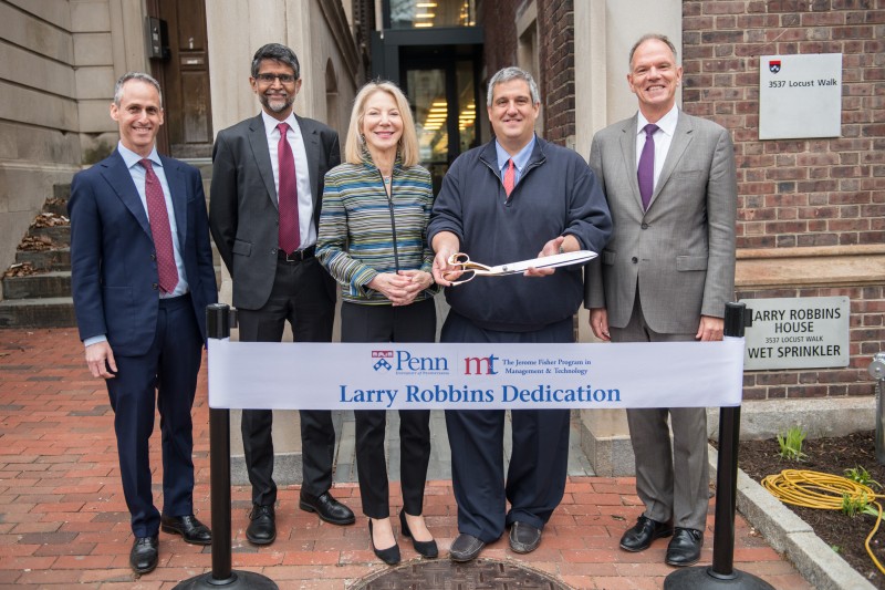caption: From left to right: M&T Director Gad Allon, Penn Engineering Dean Vijay Kumar, President Amy Gutmann, Larry Robbins and Wharton Dean Geoffrey Garrett in front of the Larry Robbins House.