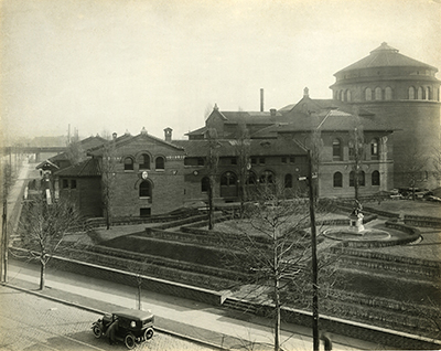 caption: The exterior of the University Museum, now known as the Penn Museum, showing the Harrison Rotunda, circa 1924.
