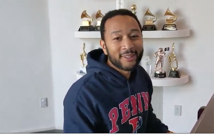 caption: A special surprise came at the end of the ceremony, when John Legend (C’99, Hon’14, Almanac February 18, 2014) joined the seniors from Penn’s numerous a cappela groups in singing “The Red and the Blue.”