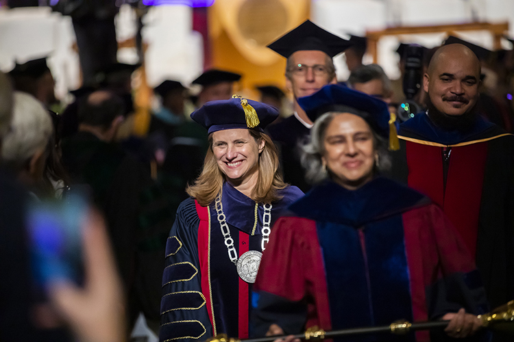 caption: President Magill walks in the academic procession as part of her inauguration. Photos by Eric Sucar and Scott Spitzer.