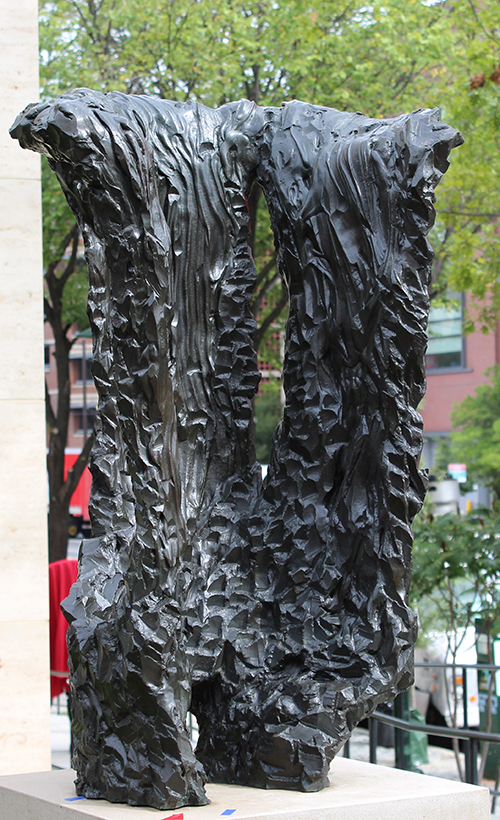 A bronze sculpture depicting folded fabric