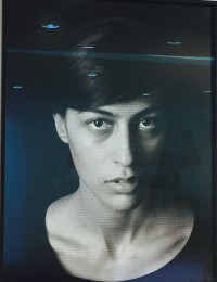 A high-contrast potrait on a black background