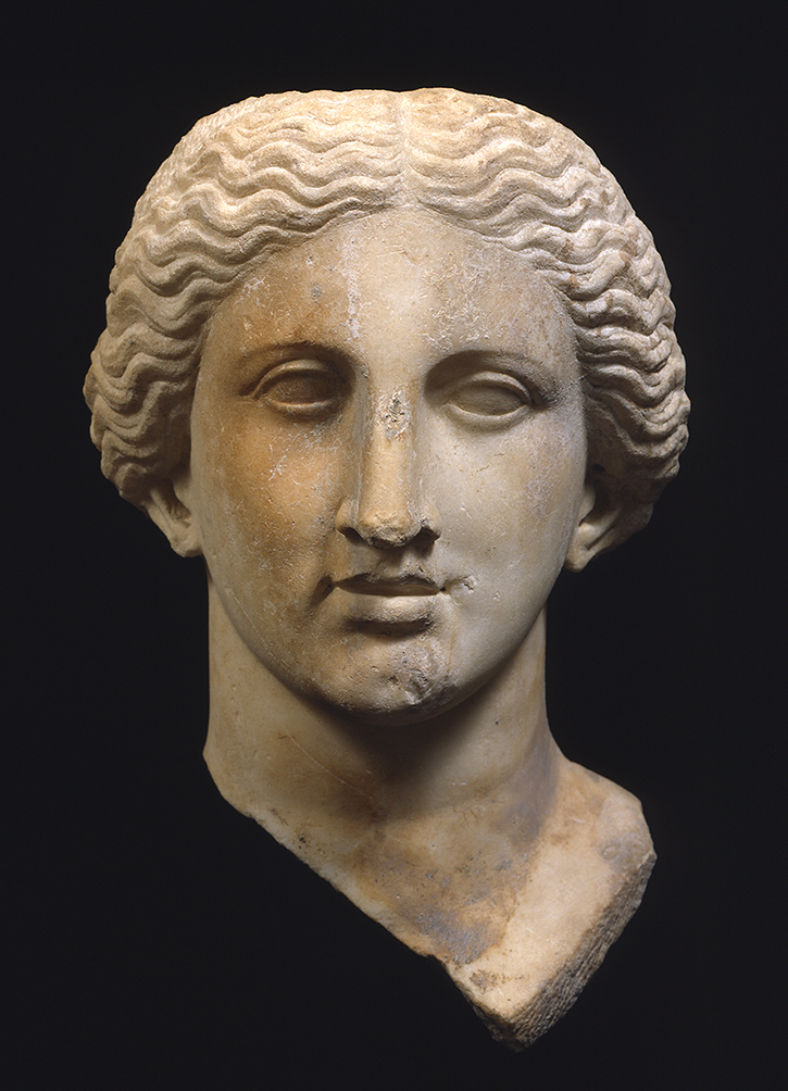 caption: A marble cult statue head (above), probably of the goddess Diana, from the late 2nd century BCE, on display in the Museum’s Worlds Intertwined: Etruscans, Greeks & Romans gallery suite. Photograph courtesy of Penn Museum.