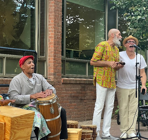 caption: rumberos performance outside of the W.E.B. Du Bois College House on Monday, October 2, 2023.