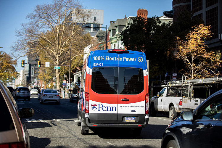 Penn has begun moving toward carbon neutrality by building LEED-certified buildings (top) and buying electric transit buses (below). 