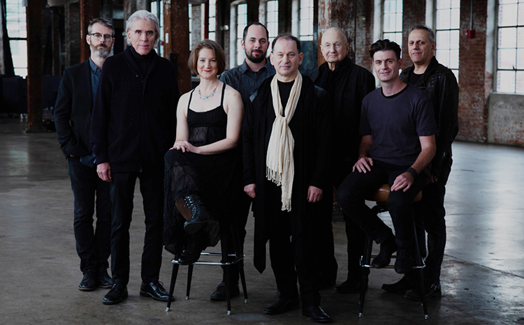 caption: The Philip Glass Ensemble performs on February 29.