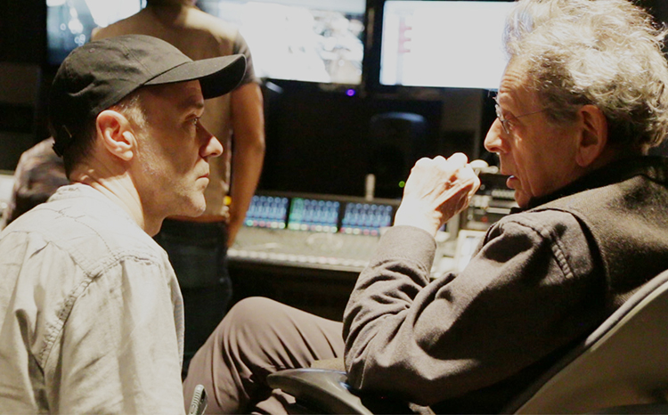 caption: Kevin Joyce and Philip Glass in rehearsal for the world premiere of Nikki Appino’s The White Lama: The Improbable Legacy of Theos Bernard.