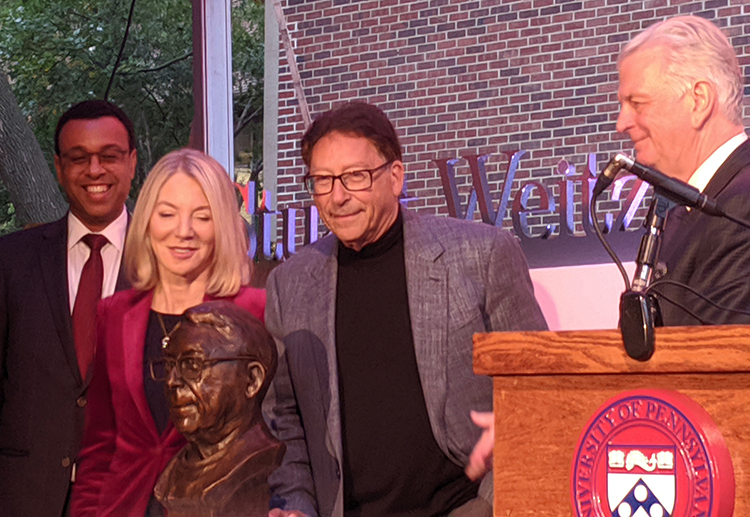 caption: Provost Wendell Pritchett, President Amy Gutmann, Stuart Weitzman and Dean Fritz Steiner at the unveiling of a bronze bust of Mr. Weitzman created by Philadelphia artist Tim Rusterholz. Photography by Marguerite F. Miller. 