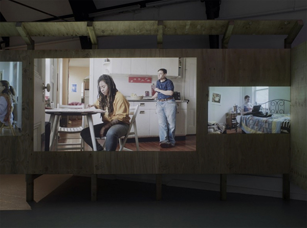 caption: Photo from a viewing of In My Little Corner of the World, Anyone Would Love You, 2016, by Sharon Hayes.