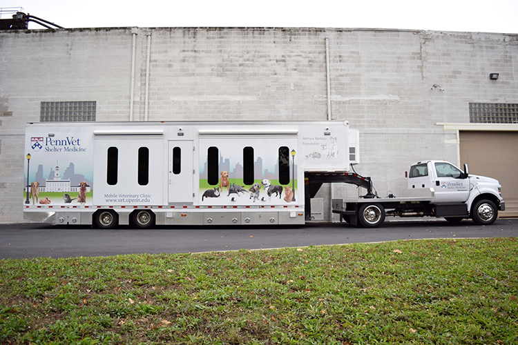 caption: The outside of the Penn Vet Mobile Clinic, a new 40-foot-long facility-on-wheels that will help vulnerable animals.