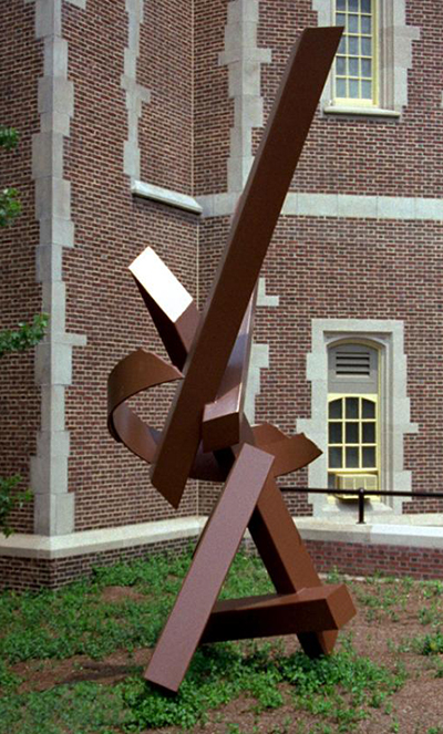 caption: Shongun XXII by Ernest Shaw was also given by art patrons Philip and Muriel Berman. The 16 x 8 foot statue is made of steel and is painted reddish brown. Sculpted in 1978, the statue is located in the School of Dental Medicine’s courtyard on 40th Street, near Spruce Street.