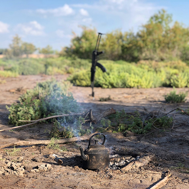 caption: Second place: Tea time near the marshes around Lagash Dawwaya, Dhi Qar Province, Iraq by Katherine Burge who studies art and archaeology of the Mediterranean world.