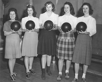 caption: Women’s bowling team, March 29, 1945, (left to right): Catherine Eni, Emily Cerceo, Virginia Hertweck, Jane Miller and Nancy Winfrey.