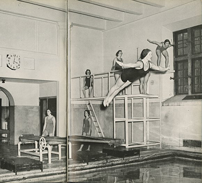 caption: Girls diving into swimming pool, appeared as cover of the sports section of the 1951 Women’s Record (the Penn women’s yearbook).
