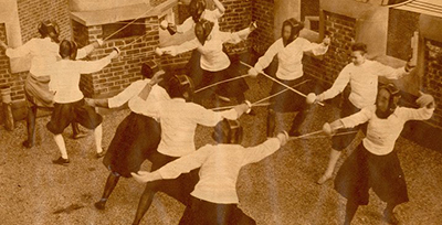 caption: Women fencers at an Eastern Pennsylvania Division Tournament, in Bennett Hall in April 1928.